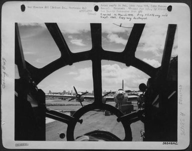 A Boeing B-29 Dispersal Area At A Saipan Base As Seen Through The Plexiglass Nose Of A Giant Superfortress. These Dreadnaughts Of The Sky Are Carrying The Attack To The War Production Centers Of The Jap Homeland And Pounding Other Jap Held Targets In The (U.S. Air Force Number 56546AC)