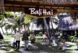 French Polynesia, tourists at entrance to Bali Hai resort on Moorea Island