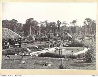 LAE, NEW GUINEA. 1944-10-31. MEMBERS OF 2/8TH GENERAL HOSPITAL AT THE AUSTRALIAN NEW GUINEA ADMINISTRATIVE UNIT (ANGAU) SWIMMING POOL. THE CONCRETE POOL WAS BUILT DURING LEISURE HOURS BY ANGAU ..