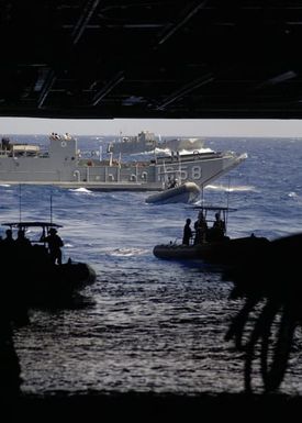 U.S. Navy Landing Craft Utility 1658 and several Rigid Hull Inflatable Boats prepare to enter the well deck of the Tarawa Class Amphibious Assault Ship USS SAIPAN (LHA 2) during operations in the Mediterranean Sea on Aug. 31, 2006. SAIPAN is currently underway conducting maritime security operations. (U.S. Navy photo Mass Communication SPECIALIST Second Class Steven J. Weber) (Released)