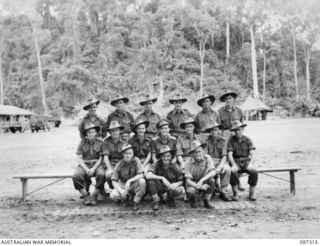 Group portrait of members of 6 Platoon, Headquarters Company, 58/59 Infantry Battalion. Identified, back row, left to right: Private (Pte) C Robertson; Pte W Noe; Pte R Hicks; Pte G Klingner; Pte G ..