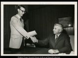 President Brower and a Man shaking hands