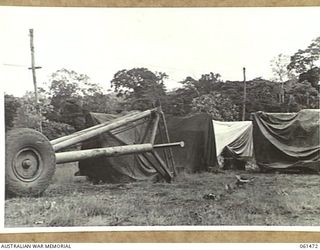 PORT MORESBY, NEW GUINEA. 1943-12-07. ORDNANCE PARK OF THE NO. 3 SUB DEPOT, 10TH AUSTRALIAN ADVANCED ORDNANCE DEPOT SHOWING 3.7 STATIC ANTI-AIRCRAFT MOUNTS WITH A "LE TOURNEY" CRANE IN THE ..
