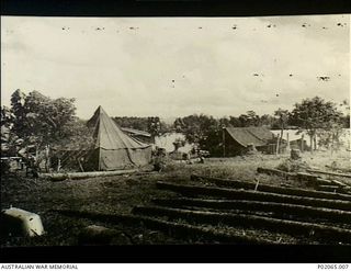 Alexishafen, New Guinea. 1944. Tents set up on the bank of a river at the final camp of 17 Field Hygiene Company. This company, with the help of indigenous (native) Papuans, worked at eradicating ..