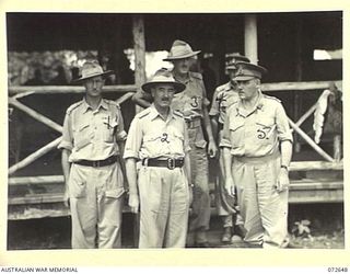 LAE, NEW GUINEA. 1944-04-24. SENIOR OFFICERS OF NEW GUINEA FORCE ABOUT TO LEAVE THE OFFICERS' MESS AT HEADQUARTERS LAE BASE SUB-AREA AFTER ATTENDING A SPECIAL LUNCHEON. IDENTIFIED PERSONNEL ARE:- ..