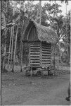 Yam house, Omarakana: full of yams, structure rests on coral boulders