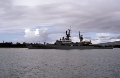 A port beam view of the guided missile cruiser USS STERETT (CG 31) departing the harbor