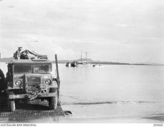 SORAKEN AREA, BOUGAINVILLE, 1945-06-11. THE HOSPITAL SHIP STRADBROKE OFF LALUM BEACH HANDLING THE EVACUATION OF WOUNDED FROM THE MAIN DRESSING STATION TO TOROKINA. COMING IN FROM THE SEA IS AN ..