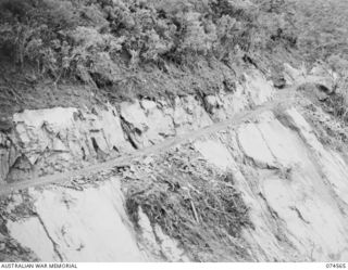 NEW GUINEA. 1944-07-09. A SECTION OF THE WAU-BULLDOG ROAD SHOWING THE DIFFICULT COUNTRY WHICH THE ROYAL AUSTRALIAN ENGINEERS HAD TO CONQUER DURING THE BUILDING OF THE ROAD