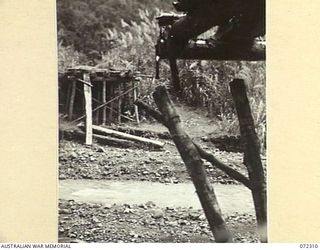 YAULA, NEW GUINEA. 1944-04-12. A BRIDGE CROSSING THE MINDJIM RIVER AT DAMOINA WHICH WAS DESTROYED BY THE JAPANESE DURING THEIR RETREAT FROM THE 57/60TH INFANTRY BATTALION