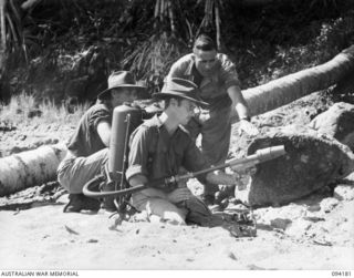 BOIKEN, NEW GUINEA. 1945-07-15. TROOPER L. W. SHERRINGHAM (1), AND  TX5600 CORPORAL JOHN MATTHEW CORBETT (SERVED UNDER THE ALIAS EDWIN HOWARD LUKES) (2), MEMBERS OF 2/10 CAVALRY (COMMANDO) REGIMENT ..