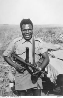 KELANOA, NEW GUINEA. 1944-03-04. 480 CORPORAL SALA, MM, "A" COMPANY, 1ST PAPUAN INFANTRY BATTALION. "A" COMPANY ARE PAST MASTERS IN JUNGLE WARFARE. LED BY EXPERT AUSTRALIAN OFFICERS AND NON ..