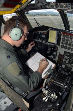 US Air Force (USAF) Lieutenant Colonel (LTC) Rob Hyee, B-52H Stratofortress long range bomber aircraft pilot, Commander, 23rd Bomb Squadron (BS), 5th Operations Group (OG), 5th Bomb Wing (BW), Minot Air Force Base (AFB), North Dakota (ND), performs final pre-flight checks inside the cockpit of his B-52H prior to departing Hickam AFB, Hawaii (HI) to fly back to the Bomber Forward Operating Location (BFOL), operated by the 36th Air Expeditionary Wing (AEW), at Andersen Air Force Base (AFB), Guam (GU). CPT Hyee and his crew evacuated Guam because it was threatened by Typhoon Sudal