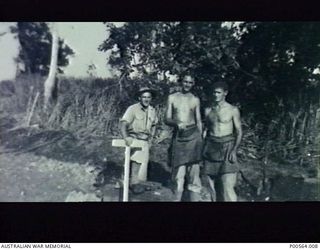 MARKHAM VALLEY, NADZAB, NEW GUINEA, 1943. WORKING PARTY SETTING OUT CAMP SITE. L TO R, SERGEANT BRUMBY, RON MCLEOD, LES MCCRADDON