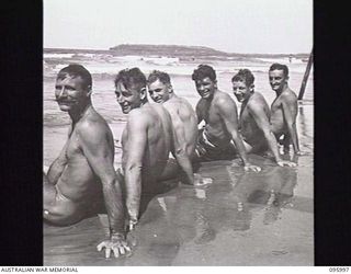 WEST WEWAK BEACH, NEW GUINEA. 1945-09-01. TROOPS OF 16 INFANTRY BRIGADE RESTING ON THE BEACH. IDENTIFIED PERSONNEL ARE:- SAPPER G. BARNES (1); CORPORAL S.A. CRAWFORD (2); SAPPER B. BAGNALL (3); ..