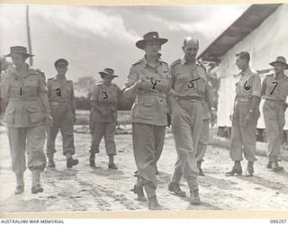 TOROKINA, BOUGAINVILLE. 1945-03-30. DEPUTY ASSISTANT COMMISSIONER OF THE RED CROSS FOR BOUGAINVILLE, R. BRYCE (5), AND SENIOR REPRESENTATIVE H. HOUGH (6), WITH LADY WAKEHURST (4), AND LADY BLAMEY ..