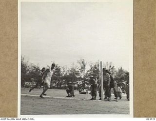 ELA BEACH, NEW GUINEA. 1944-01-01. VX3396 CORPORAL D. P. PIERCE OF THE 10TH LINES OF COMMUNICATION PROVOST COMPANY (1) WINNING THE 220 YARDS CHAMPIONSHIP FINAL AT THE ALLIED SERVICES GRAND SPORTS ..