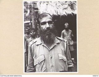 KUMUIA YAMA, RABAUL AREA, NEW BRITAIN. 1945-09-17. LIEUTENANT COLONEL ISHAQ, OC HYDERABAD STATE FORCE. WHILE INTERNED AT THE INDIAN PRISONER OF WAR CAMP HE WAS FORCED TO WORK WITH HIS SEPOYS ..