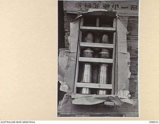 RABAUL, NEW BRITAIN. 1945-11-20. A BOX OF JAPANESE 75 MM AMMUNITION IN STORAGE IN 11 DIVISION AREA, SHOWING RUST AND CORROSION CAUSED BY POOR WATERPROOFING