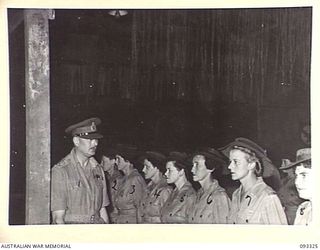 LAE AREA, NEW GUINEA, 1945-06-28. HIS ROYAL HIGHNESS, THE DUKE OF GLOUCESTER, GOVERNOR-GENERAL OF AUSTRALIA (1) INSPECTING PERSONNEL AT THE AWAS BARRACKS DURING HIS TOUR OF INSPECTION OF AUSTRALIAN ..