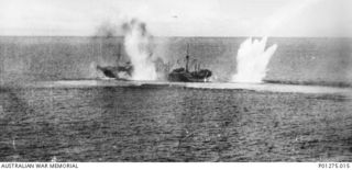 Bismarck Sea. 1943-03-03. A Japanese merchant vessel receives a direct hit while another bomb is a near miss to the stern. This vessel was part of a large Japanese convoy attacked by Allied ..