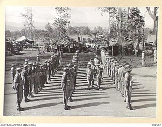 LAE AREA, NEW GUINEA, 1945-08-05. BRIGADIER P.S. MCGRATH, DEPUTY DIRECTOR OF SUPPLIES AND TRANSPORT (1) ACCOMPANIED BY SENIOR OFFICERS DURING AN INSPECTION OF NO. 74 PLATOON, 151 GENERAL TRANSPORT ..