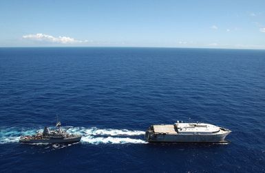 The US Navy (USN) experimenl High Speed Vehicle 2 (HSV 2) Swift refuels the Mine Countermeasures Ship USS AVENGER (MCM 1) off the coast of Hawaii (HI) during Exercise RIM OF THE PACIFIC (RIMPAC) 2004. The Swift is a wave-piercing aluminum-hulled camaran that can move at speeds greater than 45 knots. With a draft allowing it to navigate in only 12 feet of water it can easily maneuver in and out of littoral environments. RIMPAC is the largest international maritime exercise in the waters around the Hawaiian Islands. This years exercise includes seven participating nations: Australia, Canada, Chile, Japan, South Korea, United Kingdom and United Stes. RIMPAC is intended to enhance the...