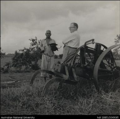 Field Officer speaking with Indian farmer