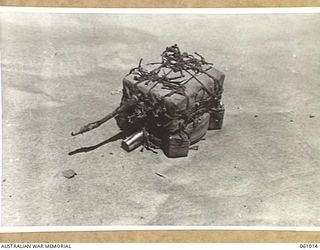 NEW GUINEA. 1943-11-24. JAPANESE MAGNETIC ANTI-TANK MINE. THIS EQUIPMENT HAS BEEN PREPARED FOR DEMONSTRATION PURPOSES BY THE COMMAND ROYAL ENGINEERS HEADQUARTERS, 9TH AUSTRALIAN DIVISION