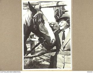 HERBERTON, QLD. 1943-06-12. VX80828 SISTER VIDA GOULD WITH THE HORSE "AKSOB", AT THE 6TH AUSTRALIAN DIVISION RACE MEETING