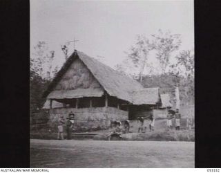 THORPEVILLE, NEW GUINEA. 1943-06-29. THE CHURCH OF ENGLAND CHAPEL AT THE 113TH AUSTRALIAN CONVALESCENT DEPOT WAS BUILT BY CONVALESCENTS AND MEMBERS OF THE STAFF. NOTE NATIVE LABOURERS EMPLOYED ..