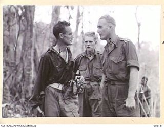 WEWAK AREA, NEW GUINEA, 1945-06-15. WO 2 K. FISK, 2/8 INFANTRY BATTALION (1), REPORTING PATROL RESULTS TO CAPT H.A. COULSTON, OFFICER COMMANDING B COMPANY, 2/8 INFANTRY BATTALION (2) ON RETURN OF ..