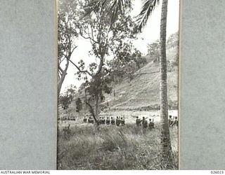 PAPUA, NEW GUINEA. 1942-07. AN AUSTRALIAN INFANTRY PATROL AFTER LEAVING THE COAST AND ITS OPEN BEACHES IS SOON SWALLOWED UP IN THE LONG GRASS THAT PRECEDES THE DENSE JUNGLE