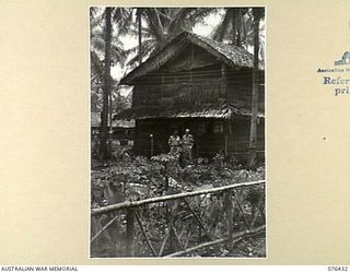 LAE, NEW GUINEA. 1944-10-04. VX1875 MAJOR J. DEWHURST, SECOND IN CHARGE (1) AND NX2227 CAPTAIN R.B. O'CONNOR ADJUTANT (2) OF THE AUSTRALIAN ARMY CANTEENS SERVICE BULK STORE, NEW GUINEA DETACHMENT, ..