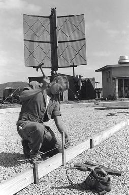 PFC Charles Isaacs from Marine Security Group 17 prepares the form for the new radar dome foundation