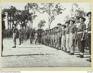 TOROKINA, BOUGAINVILLE. 1945-04-28. MAJOR GENERAL C.H. SIMPSON, SIGNAL OFFICER IN CHIEF (4), INSPECTING A PARADE OF B CORPS SIGNALS, 2 CORPS, WITH LIEUTENANT COLONEL D.F. WILEY (3), DURING HIS ..