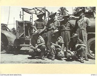 SOUTH ALEXISHAFEN, NEW GUINEA. 1944-07-24. PERSONNEL OF THE 2/83RD LIGHT AID DETACHMENT SECTION ATTACHED TO NO. 27 BATTERY, 2/14TH FIELD REGIMENT. IDENTIFIED PERSONNEL ARE:- SX11059 SERGEANT P. ..