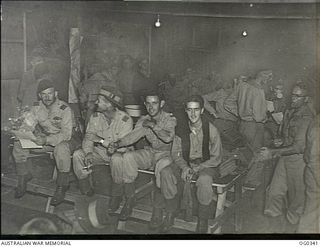 VIVIGANI, GOODENOUGH ISLAND, PAPUA. C. 1943-11. RAAF BEAUFORT CREW OF NO. 6 (BEAUFORT) SQUADRON RAAF ON THEIR RETURN FROM A HEAVY NIGHT RAID ON RAPOPO AND VUNAKUNAU AERODROMES AT RABAUL. THE ..