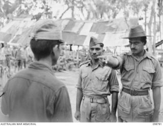 RABAUL, NEW BRITAIN. 1945-11-15. AN IDENTIFICATION PARADE OF SUSPECTED JAPANESE WAR CRIMINALS WAS ARRANGED BY THE WAR CRIMES COMMISSION AT HEADQUARTERS 11 DIVISION. SHOWN, AN INDIAN SOLDIER ..