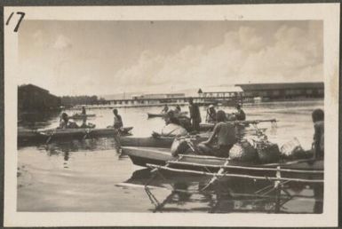 Tolai men bringing their produce in canoes to Rabaul, New Britain Island, Papua New Guinea, approximately 1916, 1