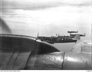 BISMARCK ARCHIPELAGO. 1944-03-28. AIRCRAFT, CODE NAMED UP-T, UP-S, UP-C AND UP-W, OF NO. 79 (SPITFIRE) SQUADRON RAAF, IN FLIGHT OVER NEW BRITAIN EN ROUTE FROM KIRIWINA TO THE ADMIRALTY ISLANDS. ..