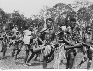 SONG RIVER, FINSCHHAFEN AREA, NEW GUINEA. 1944-03-26. SIO BOYS FROM THE FINSCHHAFEN AREA PICTURED DURING A SING SING IN THE AUSTRALIAN NEW GUINEA ADMINISTRATIVE UNIT COMPOUND CELEBRATING RE ..