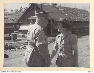 LAE, NEW GUINEA. 1945-05-11. GENERAL SIR THOMAS A. BLAMEY, COMMANDER-IN-CHIEF, ALLIED LAND FORCES, SOUTH WEST PACIFIC AREA (1), BEING GREETED BY LIEUTENANT COLONEL M.J. SPENCER, ASSISTANT ..