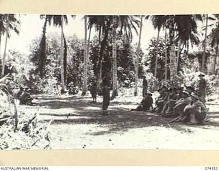 SIAR, NEW GUINEA. 1944-06-25. PERSONNEL OF THE 57/60TH INFANTRY BATTALION LISTENING TO A LECTURE DURING A UNIT NON COMMISSIONED OFFICERS CADRE COURSE. IDENTIFIED PERSONNEL ARE:- VX147344 SERGEANT ..