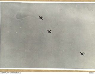 FARIA RIVER, NEW GUINEA. 1944-01-20. MITCHELL BOMBERS MOVING INTO ATTACK JAPANESE POSITIONS ACROSS MAIN CREEK