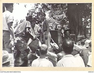 RABAUL AREA, NEW BRITAIN. 1945-09-13. CHINESE CIVILIANS, INTERNED BY THE JAPANESE AT A CAMP 15 MILES WEST OF RABAUL, WERE CONTACTED BY A PARTY OF AUSTRALIAN ARMY AND RED CROSS OFFICIALS SOON AFTER ..
