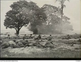 KIRIWINA, TROBIAND ISLANDS, PAPUA. C. 1944-03. GUARDS OF NO. 30 (BEAUFIGHTER) SQUADRON RAAF, ATTACK A PILLBOX AS PART OF THEIR GROUND DEFENCE TRAINING