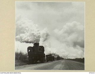 LAE, NEW GUINEA. 1944-09-27. PERSONNEL OF A UNITED STATES ARMY CHEMICAL WARFARE UNIT TESTING A PORTABLE SMOKE SCREEN TRUCK IN CO OPERATION WITH THE 43RD FIELD ORDNANCE DEPOT