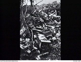 Jacquinot Bay, New Britain. c.1946. The vehicle dump at the end of Jacquinot Bay airstrip showing trucks and other vehicles that were dumped at the end of the war