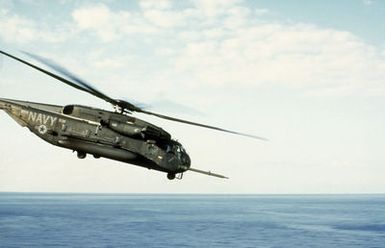 A CH-53E Super Stallion helicopter approaches for a landing on the flight deck of the amphibious assault ship USS GUAM (LPH-9) during flight operations off the coast of Beirut, Lebanon